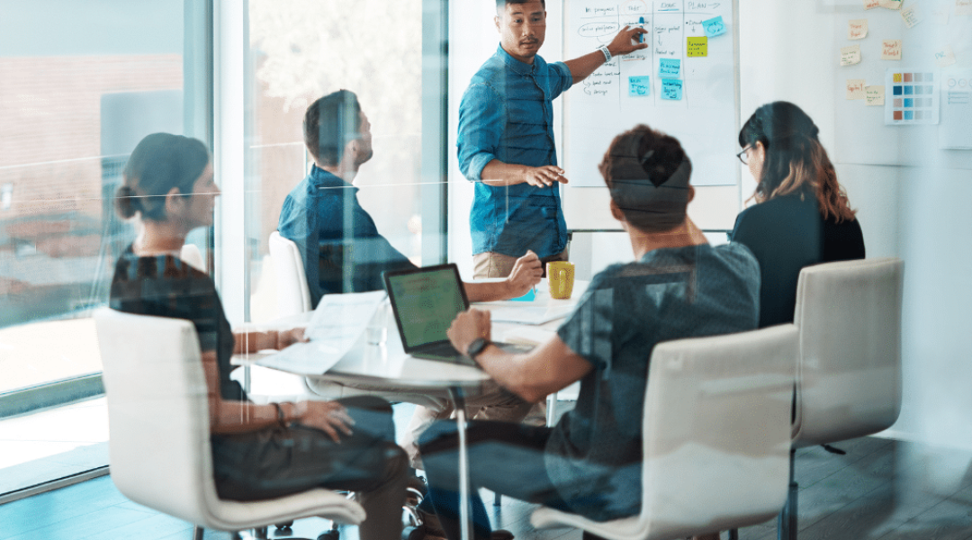 Sales recruitment strategy meeting with high-performing sales team